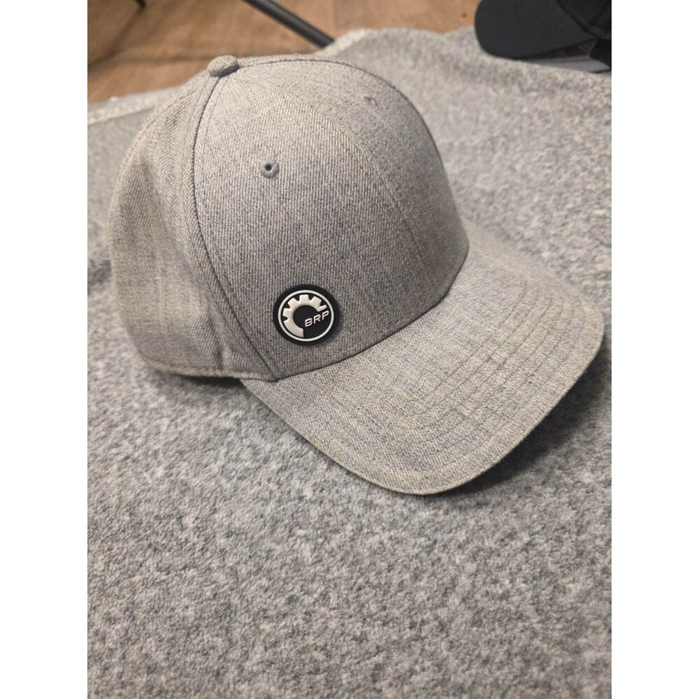 gray baseball cap features a BRP Bombardier Recreational Products logo medallion
